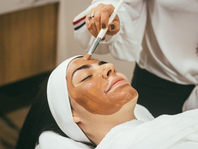 Aesthetician applying a facial treatment