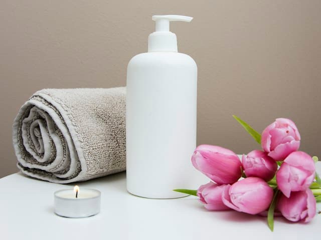 Spa towels, lotion and flowers